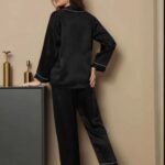 Back view of black silk night suit with long sleeve shirt and pajama trousers