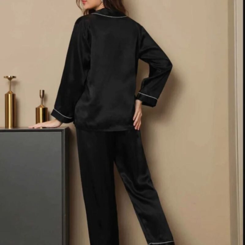 Back view of black silk night suit with long sleeve shirt and pajama trousers