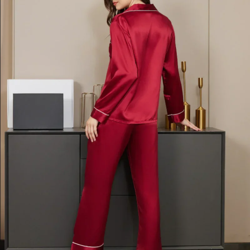 Back view of red silk night suit with long sleeve shirt and pajama trousers