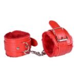 Red bondage hand cuffs included in 10 piece BDSM kit