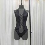 black sheer lace mesh bodysuit on mannequin