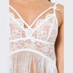 Close up shot of white fancy lace nighty dress in pakistan showing floral mesh and bow accent