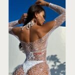 White fishnet dress for women with long sleeves showing back view and open mesh design
