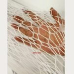 White fishnet dress for women with long sleeves showing close-up fabric texture and elastic mesh design