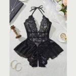 Black floral lace halter bodysuit laid flat, showing neck ribbons, a deep V front and sheer side frills