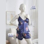 Navy blue floral cami and shorts set with lace trim displayed on mannequin