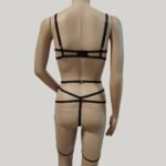 Back view of black strappy bodysuit with adjustable straps and hook closure