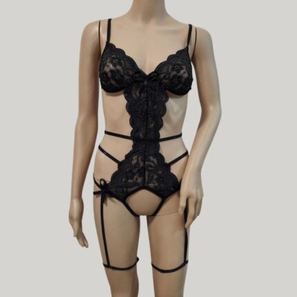 Black strappy bodysuit with embroidered lace and thigh straps on mannequin